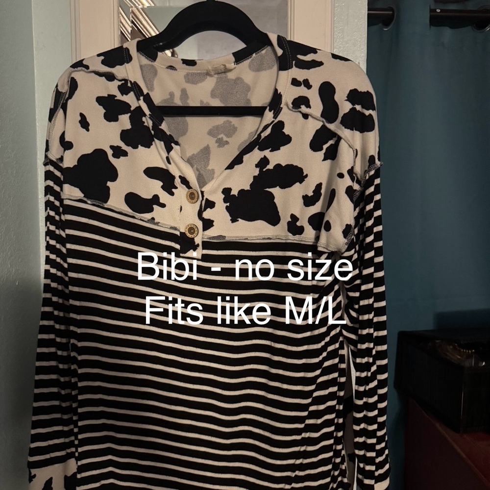 Cute top! Comfortable & fun print.